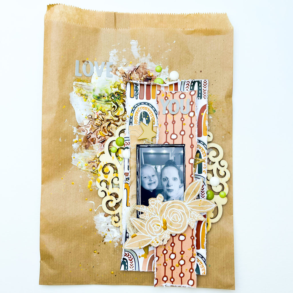Mixed media layout on a paper bag